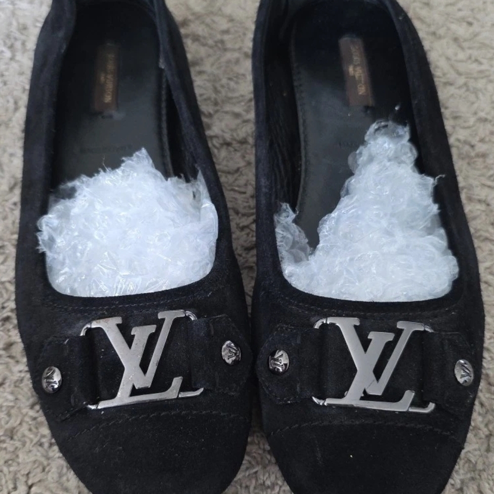Louis Vuitton Black Flats with Signature Silver Emblem